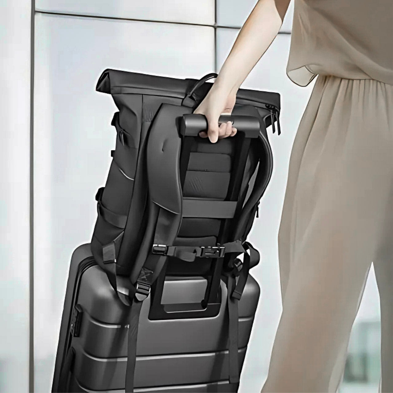 the roll top compact backpack - luggage sleeve